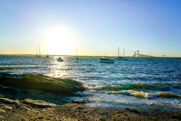 Sun begins to set in Newport, Rhode Island. 