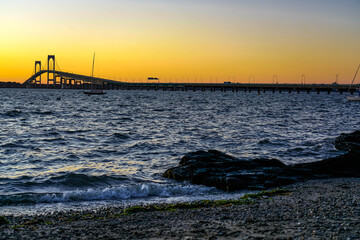 Pell Bridge in Newport, Rhode Island under dramatic sky.