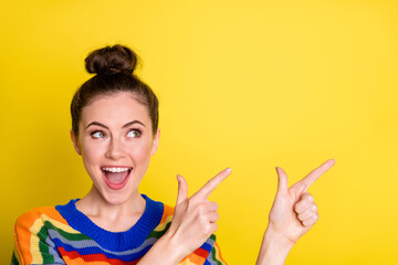 Photo of attractive person direct fingers empty space promo open mouth isolated on bright yellow color background