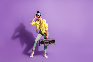Full body photo of young beautiful woman happy positive smile enjoy radio music hold boombox isolated over violet color background