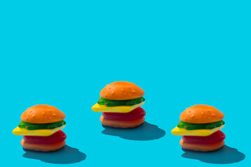 Toy hamburger fast food pattern on blue background