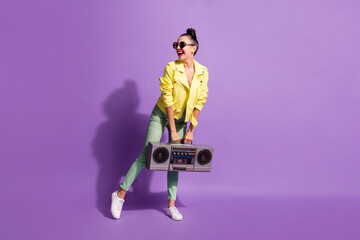 Full body photo of young girl positive smile music lover hold boombox look empty space isolated over violet color background