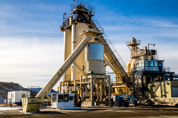 Fototapeta na wymiar Ashphalt plant sits idle waiting for workers. Calgary, Alberta, Canada
