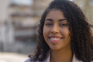 Black woman smilling on urban background