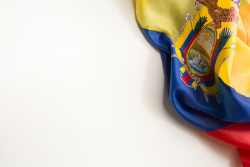 flag of the ecuador wrinkled placed on a white background on the right diagonal side - obrazy, fototapety, plakaty