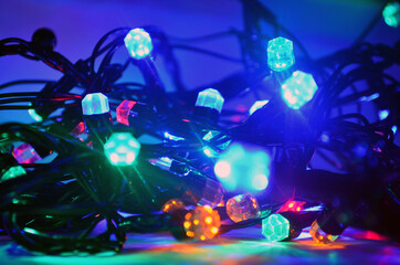 New Year's glowing garland. Lights on the Christmas tree. Decorations, celebration.