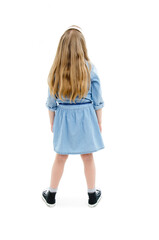 Back view of little girl looking at wall. Rear view. Isolated on white background 

