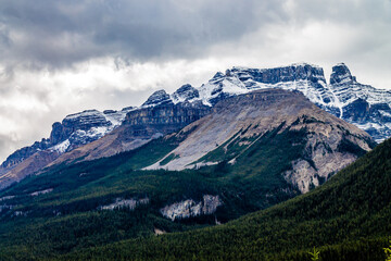 Clouds move in over the Rockies along the Icefields Parkway. Banff National Park, Alberta, Canada