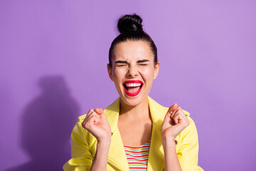 Portrait of young excited happy smiling attractive girl woman with red lipstik hold fists open mouth isolated on violet color background
