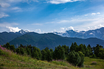 Mountain valley against the blue sky