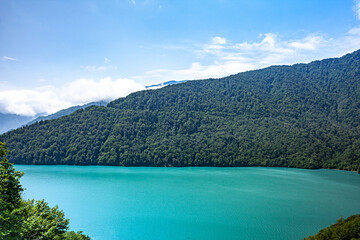 Turquoise lake in the mountains against the background of mountains