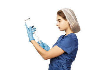 Female doctor in blue gloves and a surgical gown holds a syringe and a jar of medicine and draws the medicine from the jar into the syringe. Health concept