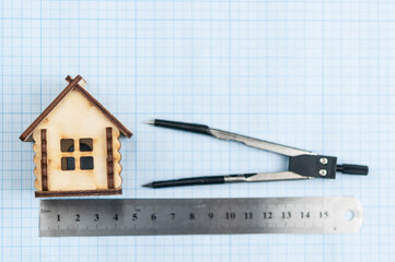 layout of the house in the paper graph background with geometry tool set. Construction concept.