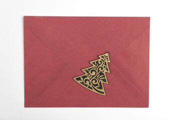 Happy new year 2021 - paper envelope with christmas decoration on white background