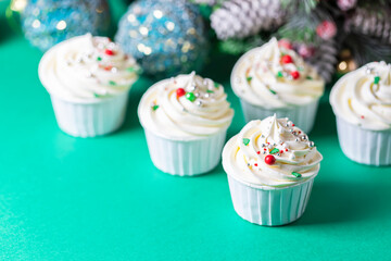 Homemade christmas cupcakes with different decorations. New year food concept.