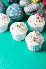 Homemade christmas cupcakes with different decorations. New year food concept.