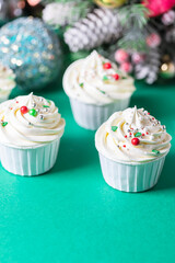 Homemade christmas cupcakes with different decorations. New year food concept.