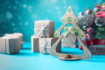 Wooden christmas tree with different decorations, zero waste concept.