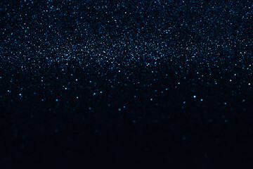 Abstract bokeh dark blue with light background.Navy blue color night light elegance,smooth backdrop,artwork design for new year,Christmas sparkling glittering or special day.Selective focus image.
