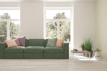 White living room with sofa and summer landscape in window. Scandinavian interior design. 3D illustration