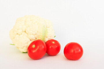 Cauliflower, tomato on a white background