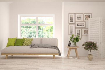 White living room with sofa and summer landscape in window. Scandinavian interior design. 3D illustration