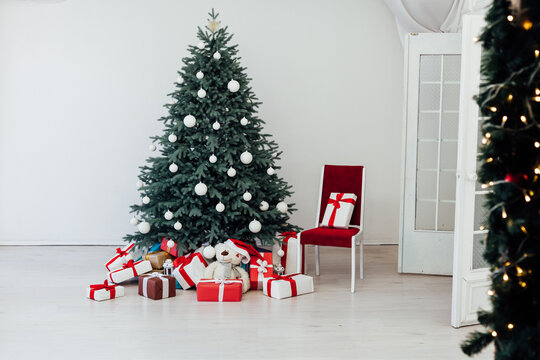 New Year's card interior red decor and Christmas tree with white gifts