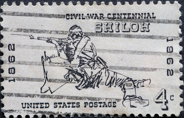 USA - Circa 1962 : a postage stamp printed in the US showing a Civil War rifleman ducking behind a...
