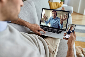 Close-up of entrepreneur having a conference call while working at home.