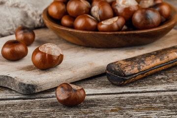 Chestnuts on an old wooden table