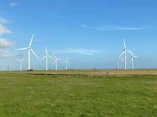 Wind turbines that produce electricity energy. Windmill Wind power technology productions Wind...
