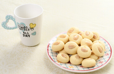 Graibe arabian biscuit with a cup of tea next to it