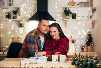 couple in the evening in the kitchen in winter