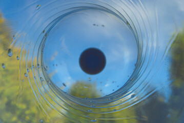 Upwards view from inside a transparent PET bottle.