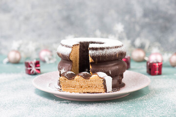 Traditional german christmas chocolate cake called Baumkuchen, winter season sweets