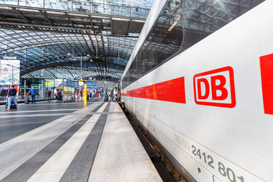 DB logo Deutsche Bahn German railways ICE 4 high-speed train at Berlin main railway station Hauptbahnhof Hbf in Germany
