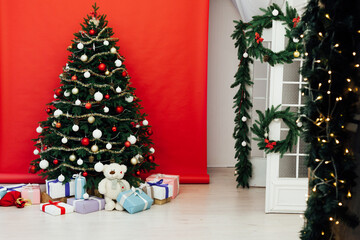 Fototapeta na wymiar Red Christmas background Christmas tree decor interior postcard