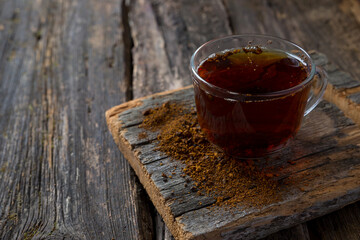 chaga birch mushroom on a dark background. Birch mushroom drink. phytotherapy. Organic superfood. Copy space