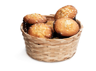 White chocolate muffins in wicker basket isolated on white