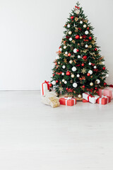 New year interior with Christmas tree with gifts decor garland December