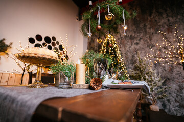 new year cozy home interior with christmas tree and garlands
