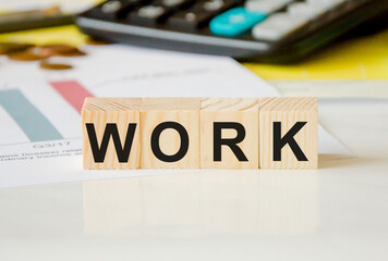 Obraz premium the word work is written on wooden cubes. the concept of unemployment, we work a lot, we live a little