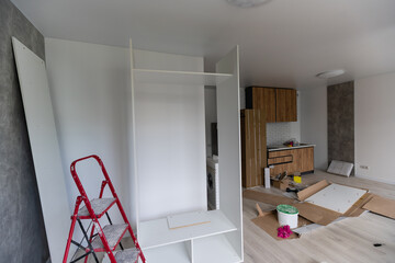 Installing new induction hob in modern kitchen kitchen Installation of kitchen cabinet.