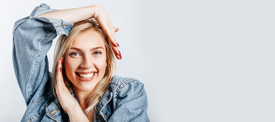 Beautiful happy young girl on gray isolated background