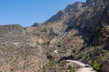 Lush green oasis with terraced fields nestled among rugged mountains near Balad Sayt, Oman