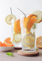 Citrus lemonade with mint on a white background.