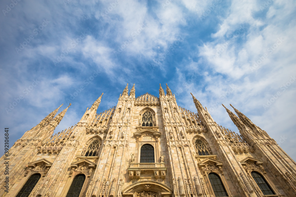 Wall mural milan cathedral (duomo di milano) with blue sky and sunset light