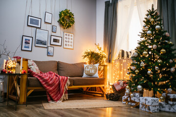 new year cozy home interior with christmas tree and garlands