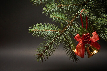 Christmas decoration with bells on a black background.