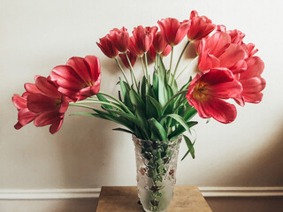 bouquet of tulips on a wooden stand